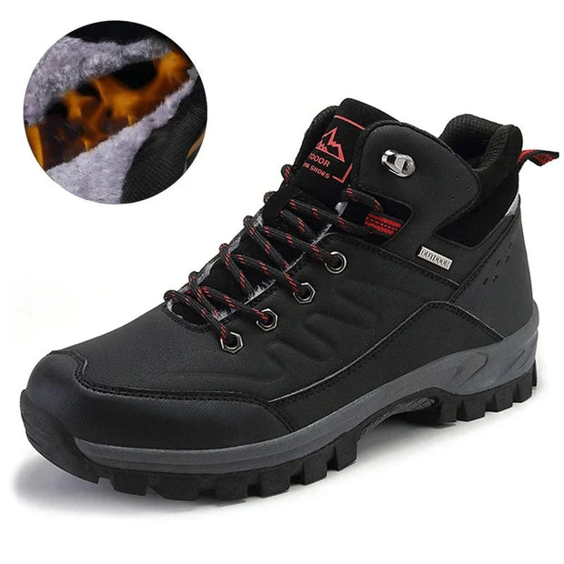 Black hiking boot with red accents on a white background