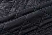 Close-up of black quilted fabric texture