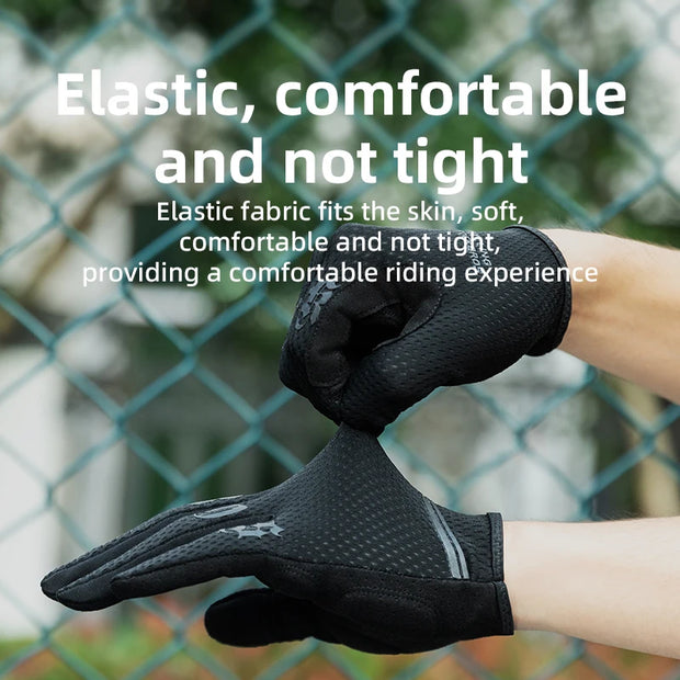 Black gloves being worn with text about elastic comfort, against a blurred green fence background.