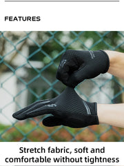 Black gloves being worn with a chain-link fence in the background