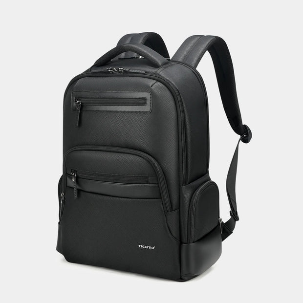 Black backpack with multiple pockets on a light gray background