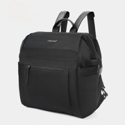 Black backpack with on a light gray background