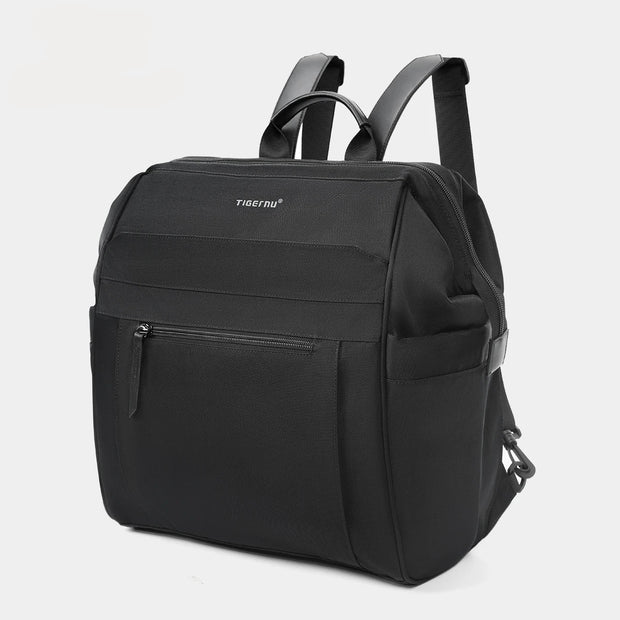 Black backpack with on a light gray background