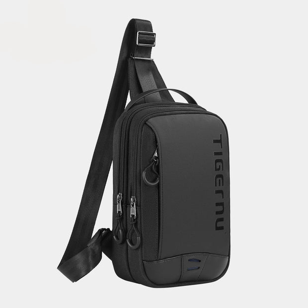 Black sling bag on a light gray background