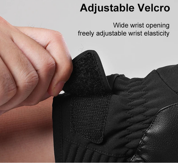 Black glove with adjustable velcro strap on a gray background