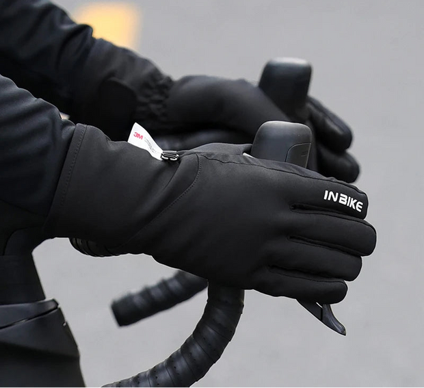 Black gloves being worn on a blurred background