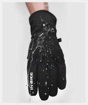 Black glove with water droplets on a white background