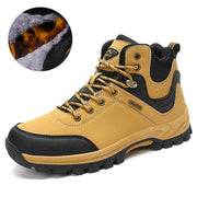 Yellow hiking boot with black accents and fur lining detail on a white background